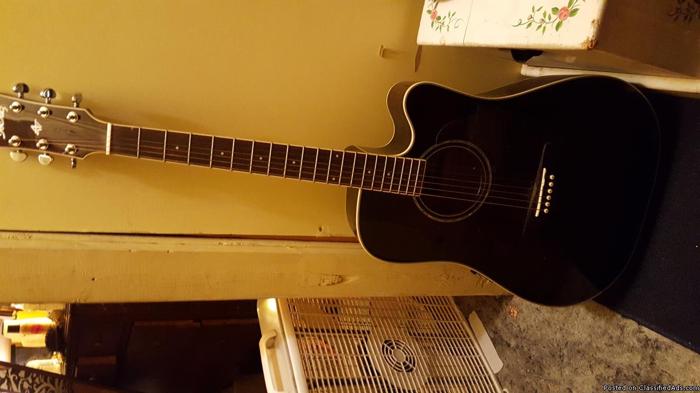 Black Ibanez electric acoustic guitar with tuner