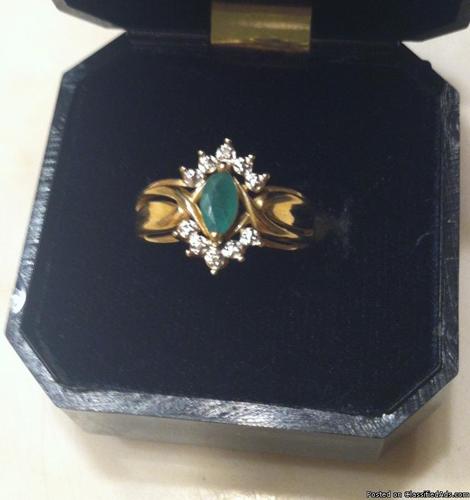emerald marquis 14C gold ring with diamonds around emerald