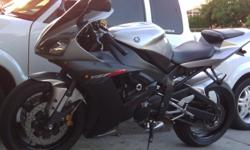 02 yamaha r1 10,000 miles silver and black stock color, yosh slip on exhaust scotts dampener new michilen power tires front and back front steel braided brake lines and much more. all papers are current and title is clean.