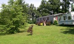 10 acres with 1998 16 x 80 mobile home,3 brdrm 2 bath, new hardwood floor in master bedrm, living rm, & hall.
New 34 x 34 metal barn with electric & water, 4 stalls. Very nice little horse farm.