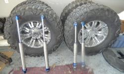 10IN. FAB TECH LIFT KIT,20IN. RIMS & 40IN. TIRES PLUS ALL SHOCKES AND ETC THAT CAME WITH LIFT KIT.