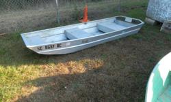 10 ft. flat bottom boat w/ troling motor and clear title.