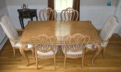 11 piece set includes table. 2 arm chairs, 6 side chairs 2 leafs soft maple bisque finish,ornate carvings,shaped legs a true beauty in dining elegance