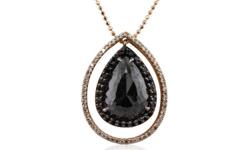 One 14KT rose gold pendant with chain containing one natural pear rose cut fancy black diamond, enhanced for color, with a total weight of 4.12ct. The pendant also contains black side stones: fancy black (color enhanced), and white side stones: G-H /