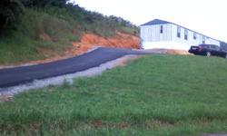 3 bedroom, 2 bath Mobile Home on a beautiful piece of property (.77 acres) in Washington County, Bristol VA. Updated cable and electric through BVU. New water lines and septic lines all done in 2009. Public water, private septic. Paved driveway and 10 x