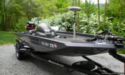 Very nice! This boat is ready to go fishing. Very stable 2004 Triton Magnum 17 feet Aluminum welded hull. Comes with boat cover, Battery charger - dual 10 amp for the two trolling batteries, seperate 12 volt battery for motor and accessories, (2) Lowrance