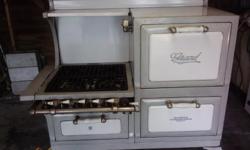 Gray/white porcelain, cast iron "Grand" model stove. 4 burners + a "warmer" burner, oven + broiler.
It is in very good, working condition and has a certificate of appraisal for $1500.00.
I can deliver myself in ohio only. PRICE LOWERED WELL BELOW