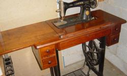 Singer Pedal Sewing Machine, with original cabinet.