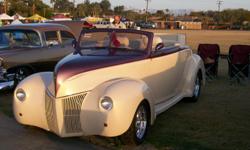 2010 July updated appraisal $82,400. 2010 Good Guys Awards of Excellence at Del Mar & Orange County.
This great driving car is chopped, lowered & shaved with a Plum Carson Harts cloth Top. All gauges are digital, Sony CD,AM/FM with Sony speakers. Hood &