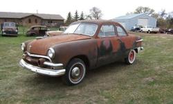1951 Ford 2 Door Sedan Custom model with stainless trim. No motor or transmission. This car has some rust in the trunk right in the back end, rust in the rockers, a small spot in the floor by the rocker and a small spot in the tip of each fender and