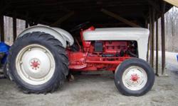 1954 Ford Jubilee,runs well,3 point hitch,live PTO,new battery,new front tires,rebuilt engine.Serial #NAA-7006.