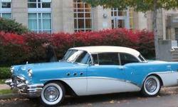 It is Two-Toned, baby blue and cream coloured with LOTS of chrome in good condition. The interior is tones of blue and the dash is all metal...no plastic in those days. The seats, ceiling, carpets, are all new and the trunk and engine are very clean. It