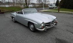 1960 Mercedes 190SL that is very presentable as it is. The car is in silver with a black interior and it comes with a white convertible top. The previous owner has restored the car over a period of 4 years. The paint is fresh and in very good condition.