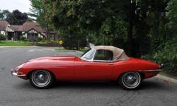 This NO RESERVE auction is for a crisp looking 1964 JAGUAR E-Type Series I roadster convertible. It is finished in a bright red exterior paint over a rich leather saddle interior. We had to keep reminding ourselves that the car we were looking at and