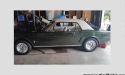 65 Mustang for sale! This is a matching numbers car with original white leather interior and original white vinyl top! Painted English racing green in 85 by the previous owner. I am the third owner since production! 289 V-8 Engine has recently been