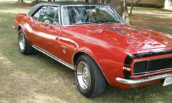 1967 Chevrolet Camaro RS, numbers matching car, 327 with power glide transmission, deluxe interior, rare option fold down rear seat, disc brakes, factory air conditioner, Bolero red, black vinly top, ralley wheels, flow master exhaust. Extra parts: 2 1/2"