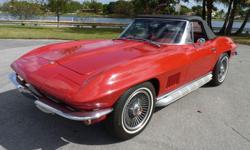 This is an absolutely gorgeous, numbers matching 1967 Chevy Corvette "Stingray" Roadster that has been completely restored. This beautiful Rally Red convertible comes equipped with 4 speed manual transmission, original numbers matching 327/300 hp V8