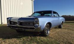 E-Mail Questions at: cynthiaciisales@clubhonda.net . Fully restored show car 1967 Pontiac GTO. This car is very nice, clean all around. This gorgeous GTO was restored to correct color Montreux Blue. Options include Pontiac teak wood steering wheel,