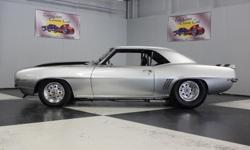 Stk#139 1969 Chevy Camaro
Painted silver with Black Stripes, steel cowl hood, rear spoiler, RS Headlights, and has new parts for head lights not installed.&nbsp; Front & rear bumpers are new.&nbsp; The emblems are new.&nbsp; There are new door handles and