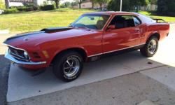 1970 Mustang Mach 1. This is a real Mach 1 and a real 4 speed car. Marti Report included.
EXTERIOR AND INTERIOR: The paint on this car is fresh and beautiful. The body is very straight and there is not a single rust bubble anywhere in the paint.
There are