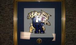 13 x 13 Wildcat Blue Mat w/ Mascot in picture 1996 NCAA Championship.
Bronze Medallion under Mascot picture. Autographed by Rick Pitino, "Go Cats, Rick Pitino
Never been hung and is in mint condition.