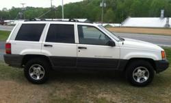 DO YOU NEED A 4X4 FOR THE WINTER MONTHS AHEAD? HERE IS A GREAT FAMILY SUV FOR ONE, IT HAS LOW MILES FOR A JEEP WITH ONLY 157,XXX MILES, IT IS WHITE WITH GREY INTERIOR, 4 DOOR, INLINE 6 4.0, POWER STEERING, POWER BRAKES, POWER WINDOWS, POWER DOOR LOCKS,