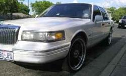 1997 lincoln towncar Pearl White and Tan Leather inside; 115k miles; eveything works
I have installed an Alarm Auto Start from 1000ft away, and 22 inch Demoda Black Rims w new tires, i also installed an out of market Screen Deck Stereo and a surround