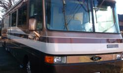 Beautiful 37', 1997 Safari Serengeti Motorhome Ivory Edition. With new batteries and front tires, this lovely home rides smoothly and just hit 92,700 miles. Wonderful for retirement living or traveling with the family. Brand new this home sells for
