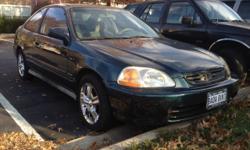 1998 Honda Civic EX with cruise control, power windows, moon roof. Good working order, has salvage title, but just had body damage fixed by insurance. Heat and a/c work great. 228500 miles, no radio. Premium chrome wheels. Clean interior. Come take it for