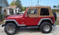 98 Jeep Wrangler. Red with tan tinted soft top. New top. New tires. 3" body lift. 124k. Call 850-777-1114