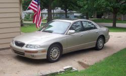1998 Mazda Millenia 4 door, champagne in color, sun roof, automatic leather seats, tan interior, heat and air conditioning work great, with approx. 174,000 miles. Have owned for over 4 years and only problem I've had until now was replacing the battery