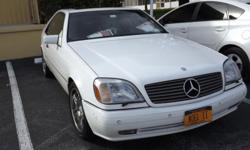 Mercedes Benz CL 600 - This car has 102,000 miles, white with two tone gray interior. Chrome wheels tires are less than a year old. Power windows, power brakes, power steering, power seats and sun roof. The car is 16 years old I have had it for 7.5 years