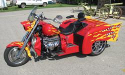 This 1999 Boss Hoss '57 Chevy trike couples the iconic fins of one of the most recongnizable cars ever produced with the thrill of a V-8 motorcycle. The trike features a factory 350ci V-8 GM engine making almost 400 HP, This bike has so much power the