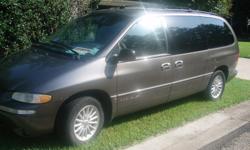 Loaded 7-passenger minivan with four captain's chairs plus third row bench seat. Dark gray exterior, tan interior. Leather seats. Power locks and windows. Keyless entry. Air conditioning. am/fm/cd/cassette. Very clean. Good condition. 93,000 miles. call
