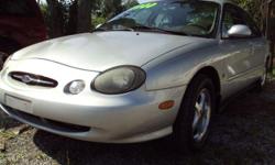 1999 Ford Taurus.
&nbsp;Great running full size 4 door car with 6 cyl. Gas mileage
Has nice tires on factory mag wheels.
lots of power items like seats locks and windows.
Has a C/D player and A/C. Everything works.
&nbsp;It has 150k. For miles. The car