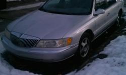 1999 lincoln continental for sell..had it for 3yrs drives great sellin it cuz its time for an upgrade..plus i dont wanna have 2cars..it has lil rust on it thats all...im askin 2200 or best offer The blue book value of my car is 2300 Come wit 2000 U hav a