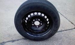 (1) 205/60R15 Goodyear Eagle GT + 4 tire on 1993 BMW 318i rim, was silver originally, now painted black, small bend on back of rim, tire has 4/32" tread remaining, would make a good spare or temporary wheel & tire, fits 1992-99 318i, $15 negotiable; Call