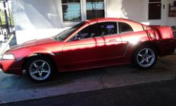 2000 Ford Mustang, 232 Motor, GT rear end, Cobra wheels (new tires), Burgundy in color with 230,000 miles. Cash only!