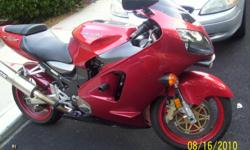 This is a red 2000 Kawasaki ZX-12 Ninja. Thats right.............RARE, most sought after supersportbike because of its POWERFUL, un-restricted engine. Also known as the Busa killer. It has 13,700 miles, 3/4 are long distance highway miles. Bike runs