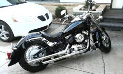Yamaha V-Star 650 25,000miles Great Condition! Already dropped, custom gas tank, Cobra pipes, Sissy Bar,wind shield, Custom Paint-Black with Ghost Flames. Garaged yr round and is in great condition. Please leave message I dont not answer my phone.