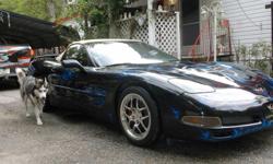 2001&nbsp; corvette converable&nbsp; black&nbsp; with&nbsp; custom blue flames&nbsp; and girl&nbsp; air brush&nbsp; on trunk&nbsp; lots of chrome 45.000&nbsp; miles tan int&nbsp; auto&nbsp; spoiler&nbsp;&nbsp; selling to buy a house have 50.000 invested
