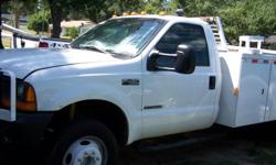 this is a 2001 f450 with a 11ft.utility box.diesel,automatic, good tires runs great.