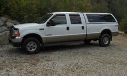 2001 FORD CREW CAB F-350, Diesel 7.3 L, white and gold exterior, tan leather interior with heated front seats,auto trans, well maintaned with 66,000 miles. Has a matching topper. In GREAT shape.