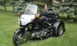 &nbsp;
2001 1800cc Goldwing/Motor Trike conversion Only 6,800 miles. Black in color. Extra chrome and LED lighting added. Trailer wired. Driver backrest.Passenger queen seat with armrests. AM/FM radio with rear speakers. CB. Excellent condition. Garage