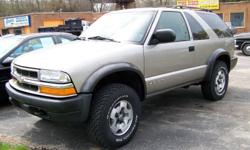 2002 Chevrolet Blazer with the ZR2 Package! Just a gorgeous SUV with lots of bells & whistles, 4 wheel drive with push button 2-Hi, 4-Hi and 4-Low buttons, gray leather interior with reclining Chevy logo embroidered bucket seats, rear bench and more room