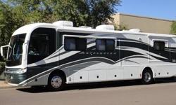 This 2002 Fleetwood Revolution 38B has 330Hp Cummins ISC Diesel, 2 slides,Entry door awning, Elec. patio awning, window awnings, 2 A/C's,7.5 Onan diesel gen., Panasonic DVD Home Theater Sound System, 2 TV's, 1 Rocker Recliners, Jack knife sofa bed,