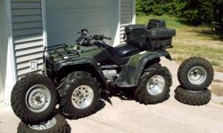 original owner stock and after market tires and rims, plow with winch, luggage rack