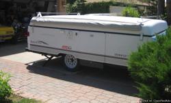 2003 Coleman Sante Fe pop up. sleeps 6-7 , 1 king bed, 1 queen bed, table converts to a double bed. Has inside and outside stoves, heater, 3way refirgerator, toilet, outside shower, awning with a screen room, lots of storage, roof rack and is in excellent