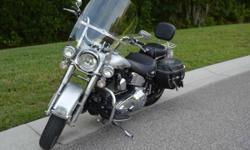 &nbsp;
&nbsp;
2003 HERITAGE SOFTAIL 100th ANNIVERSARY, yes it was laid on a right side, damage was superficial and replaced parts included : handlebars, windshield, front safety bar and exhausts. Bike have 15010 miles and runs great.
if you have any