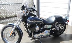 2003 FXDL DYNA LOW RIDER, 100TH YEAR EDITION - 25,618 - 1400cc - GUN METAL BLUE - FAIRLY NEW TIRES -WELL TAKEN CARE OF! EXTRAS? SADDLE BAGS, HD COVER, 100TH EDITION MATCHING HELMET (L), LUGGAGE RACK. . BATTERY CHARGER, HD CHAIN WITH LOCK&nbsp;?.$6500